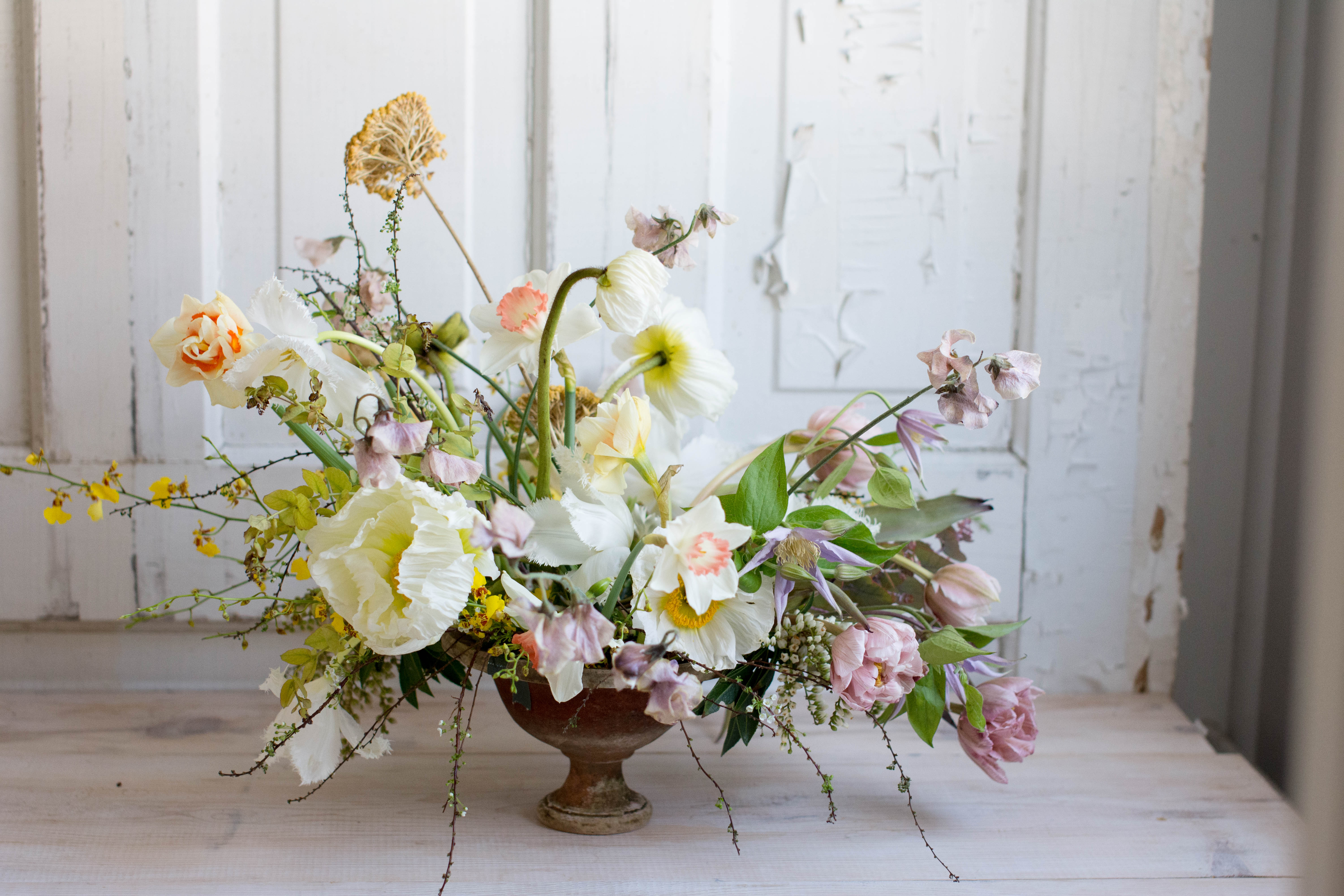Yellow poppy centerepice for spring wedding flowers